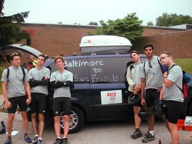 Groups pose in front of the newly decorated vans in Michigan City, IN.