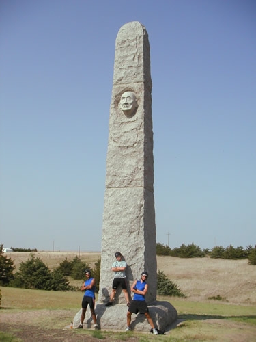 Rajeev, Brent, and Mark pose by the Massacre Valley Monument near Trenton, NE.