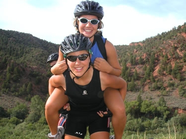 Ashley G. and Sarah pose by a canyon in western Colorado.