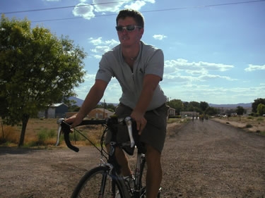 Ryan bikes back to the Fire Hall, our accommodations in Panaca, after the parade.