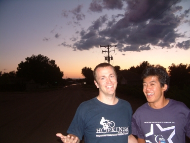 Sam and Weijie enjoying life in Wiggins in front of a far-away view of the Rockies.