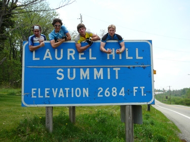 they don't just climb mountains. they climb signs, too.