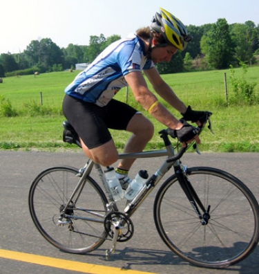 Chris can do tricks on his bike.