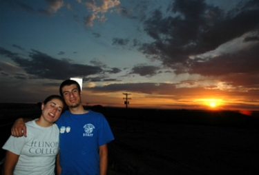 husband and wife enjoying the beautiful wiggins sunset