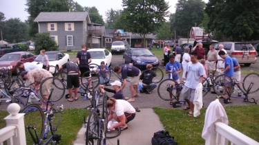 Bike cleaning at dusk outside the Fayette Christian Church, after the stormy day through the Ohio fields.